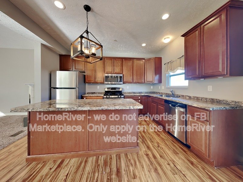 3BR Townhome | Cozy Fireplace | Garage and Driveway Parking property image